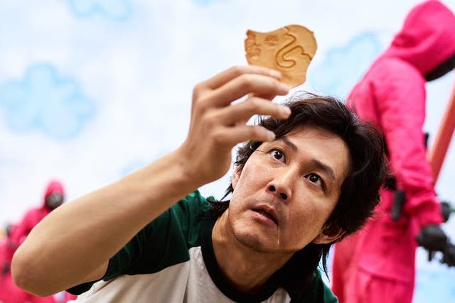 <p>Desperation leads Seong Gi‑hun into the unknown in an effort to assuage his debts</p>