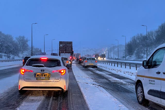 Heavy snow is causing chaos on roads in parts of northern England and Wales with many routes blocked (PA)