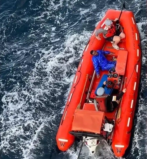 US soldiers save a man stranded in the waters off Obi Island, Indonesia