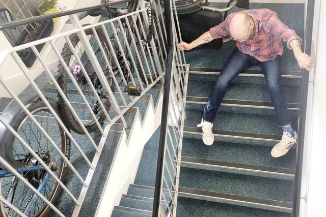 <p>Chris Purnell dragging himself down the stairs of his block of flats in Granton, Edinburgh.</p>