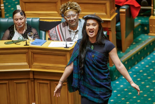 <p>Te Pati Maori MP Hana-Rawhiti Maipi-Clarke protests during the swearing-in ceremony at the parliament in Wellington, New Zealand, on 5 December 2023</p>