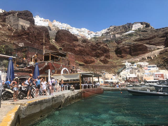 <p>Danger zone? Summer tourists in Santorini, before the present sequence of earthquakes began</p>