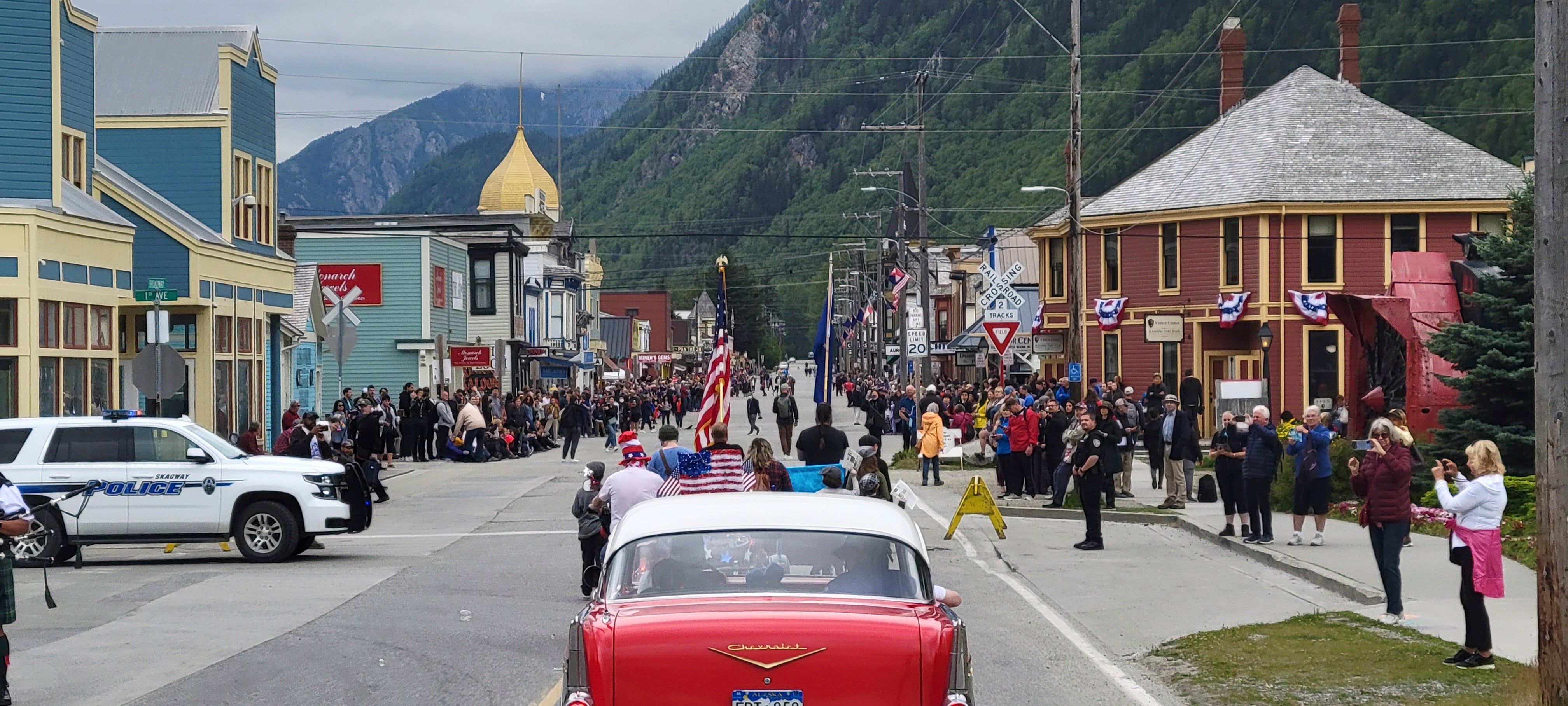 People gather along the streets of Skagway, Alaska, for a Fourth of July parade in 2023