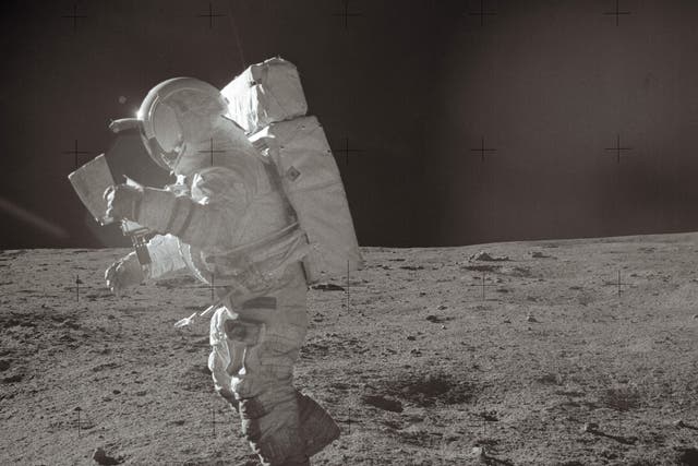 <p>A picture taken on 6 February, 1971 shows Astronaut Edgar Mitchell moving across the lunar surface while looking over a traverse map. Nasa says future astronauts will be able to use GPS navigation on the Moon</p>