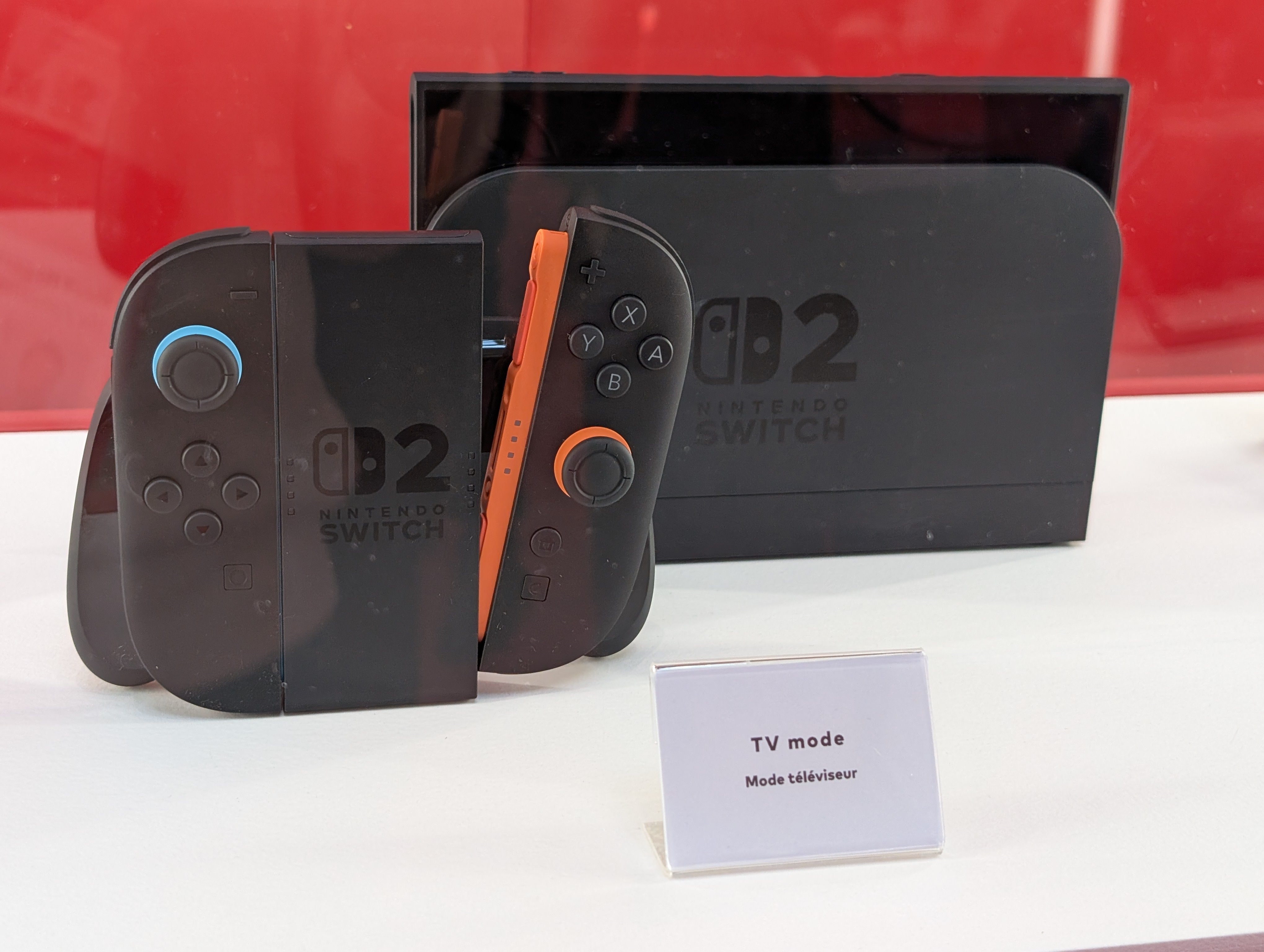 The Nintendo Switch 2 on its dock, with the Joy-Con 2 in the controller grip