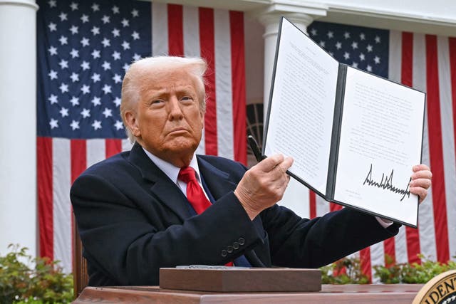 <p>President Donald Trump holds up a chart of 'reciprocal tariffs' while speaking during a 'Make America Wealthy Again'  event in the White House Rose Garden</p>