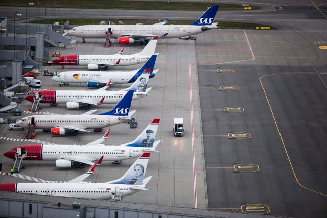 <p>No go: Norwegian aircraft and an SAS jet at Oslo airport</p>