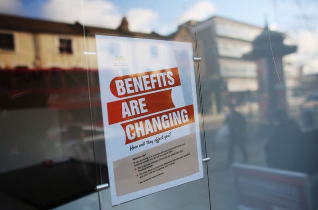 A sign informs members of the public on changes to Benefits on Lewisham high street on December 5, 2012 in London, England. 