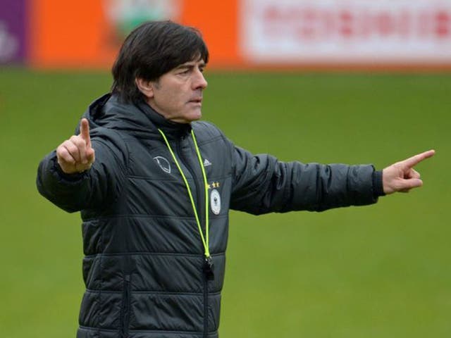 Joachim Low points the way for Germany during training in Barnet as they prepare to face England at Wembley on Tuesday night