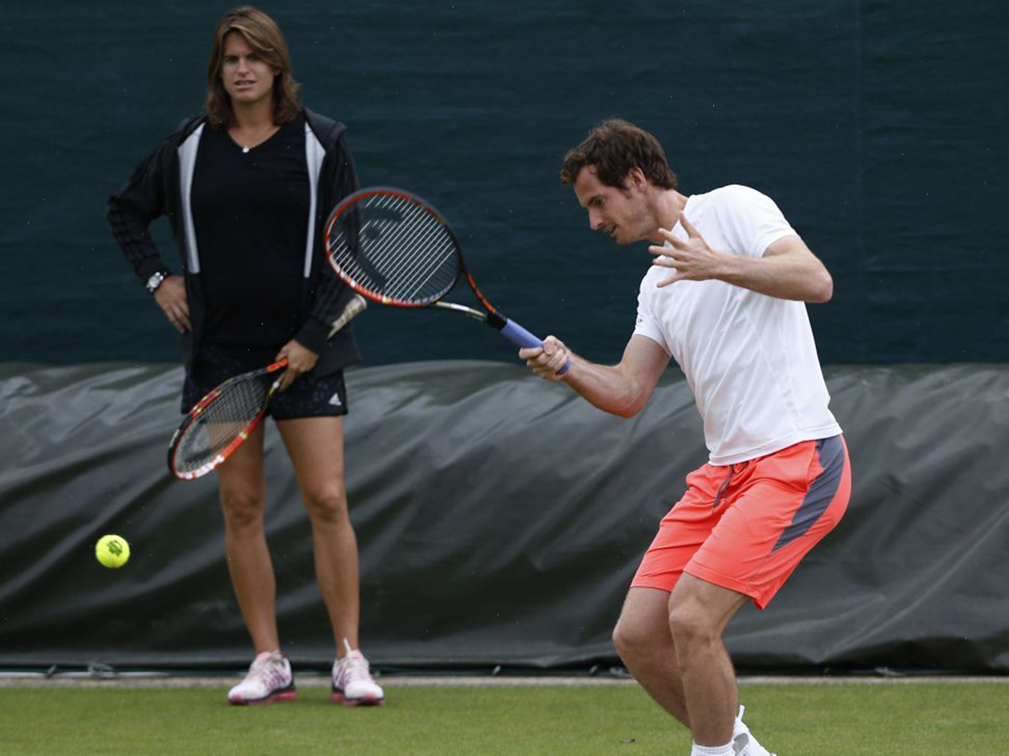 Andy Murray trains at Wimbledon under the watchful eye of coach Amélie Mauresmo
