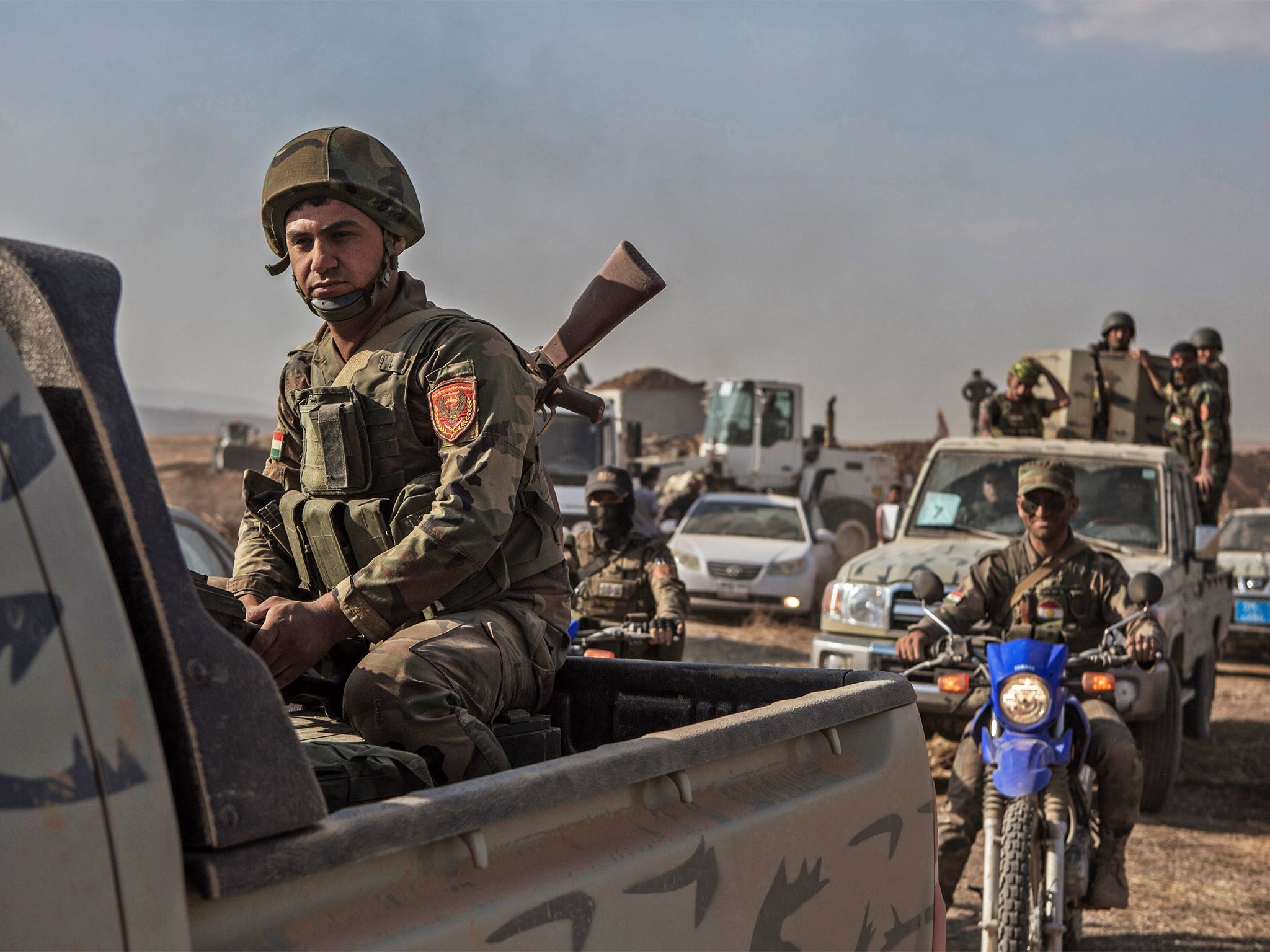 Kurdish Peshmerga forces move into Mufti village, east of Mosul, after it was recaptured from Isis earlier this week