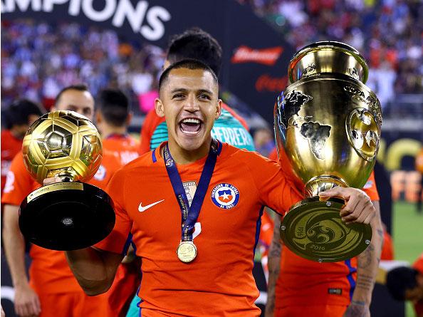 Alexis Sanchez recovered enough to celebrate with the Copa America trophy and the player of the final award (Getty)