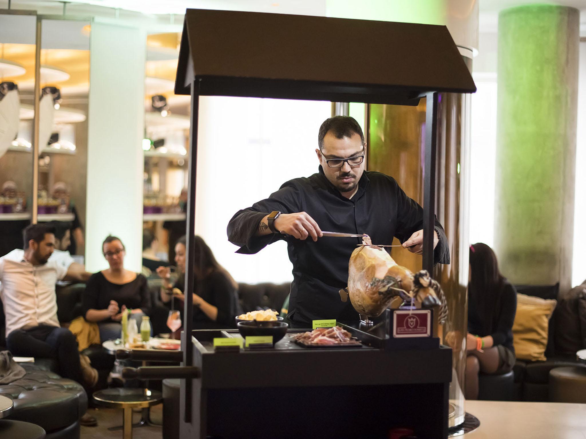 The iberico ham station is fun to watch in action