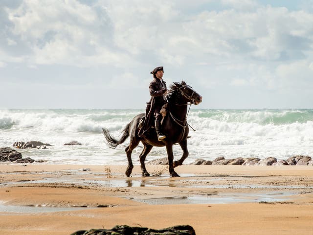 Riding out: Ross Poldark (Aidan Turner) on the beach